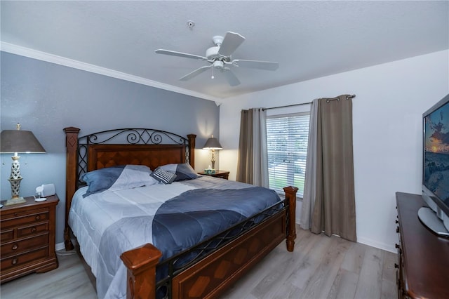 bedroom with ornamental molding, light hardwood / wood-style flooring, and ceiling fan