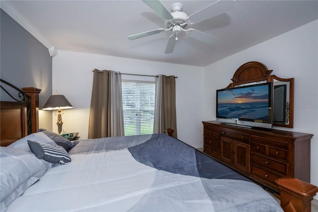 bedroom featuring ceiling fan and crown molding