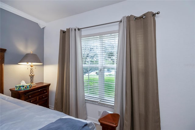 bedroom with ornamental molding