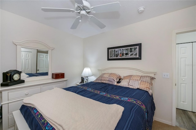 bedroom featuring light hardwood / wood-style floors and ceiling fan