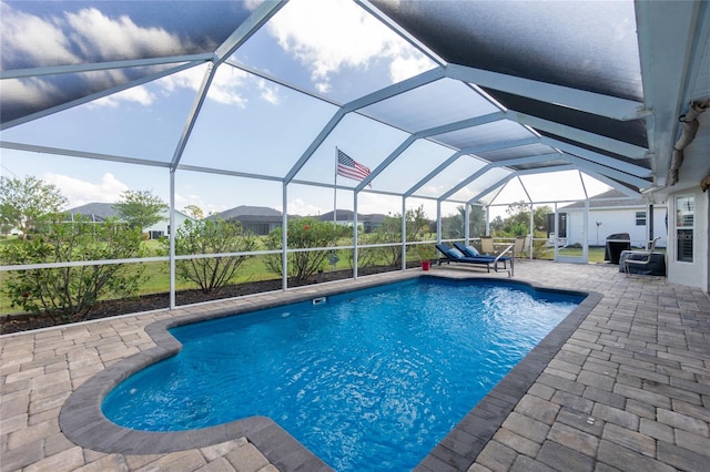 view of pool featuring a patio and a lanai