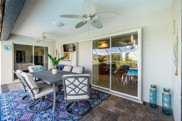 interior space with ceiling fan