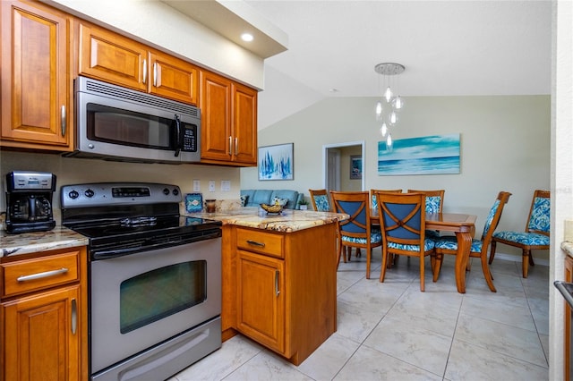 kitchen featuring kitchen peninsula, appliances with stainless steel finishes, lofted ceiling, and light stone countertops