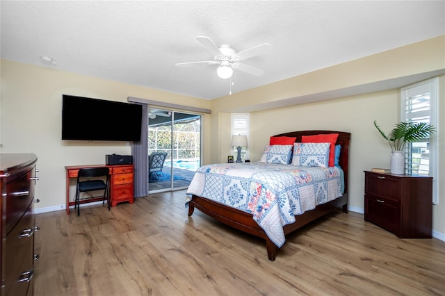 bedroom featuring access to outside, ceiling fan, and light hardwood / wood-style flooring