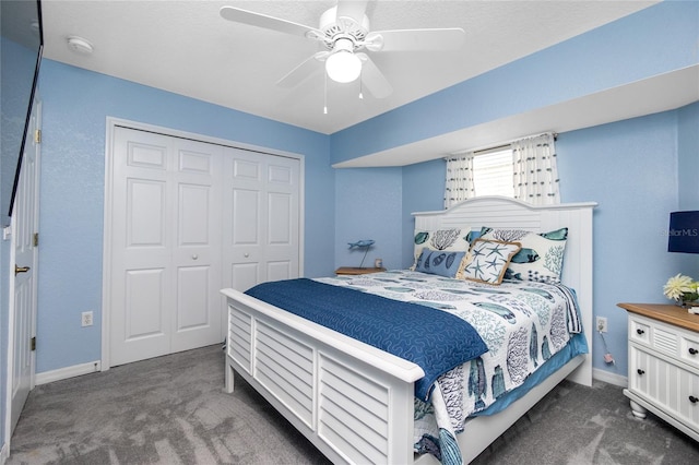 carpeted bedroom with a closet and ceiling fan