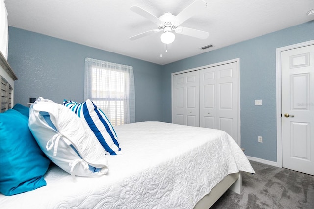 bedroom featuring ceiling fan, a closet, and carpet