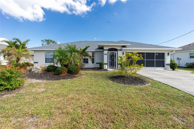 single story home featuring a sunroom and a front yard