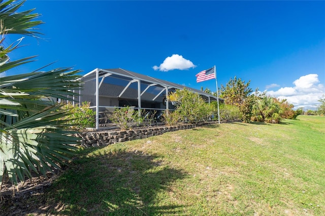 view of yard featuring glass enclosure