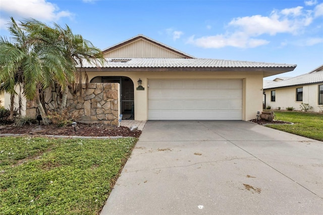 view of front facade with a front lawn and a garage