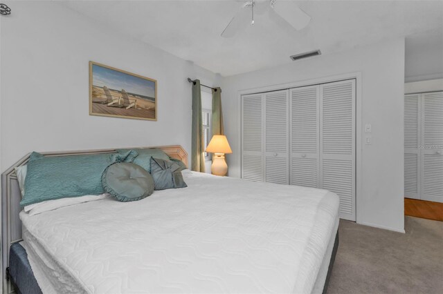 bedroom featuring carpet, ceiling fan, and a closet