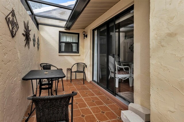 view of patio with a lanai