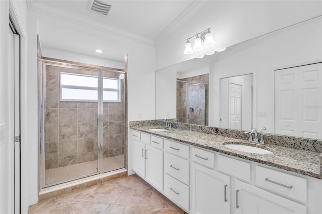 bathroom with tile patterned flooring, vanity, a shower with shower door, and ornamental molding