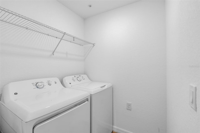 laundry area with separate washer and dryer