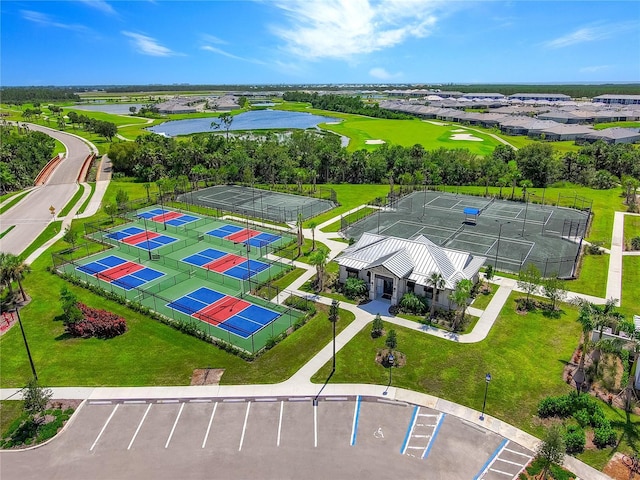 birds eye view of property with a water view