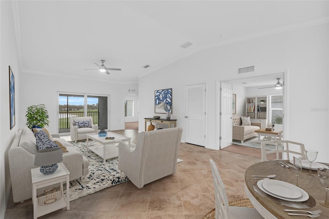 tiled living room with vaulted ceiling and ornamental molding