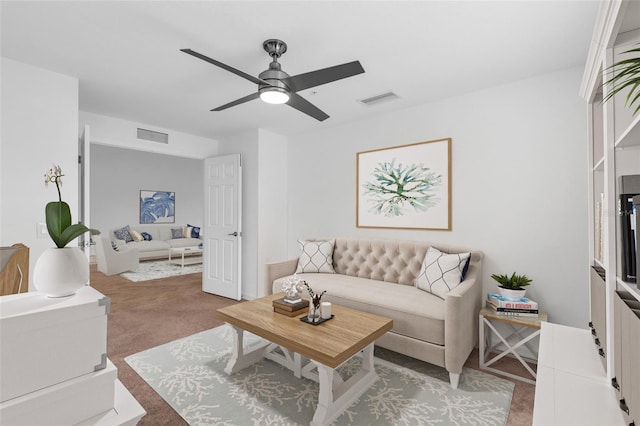 carpeted living room featuring ceiling fan