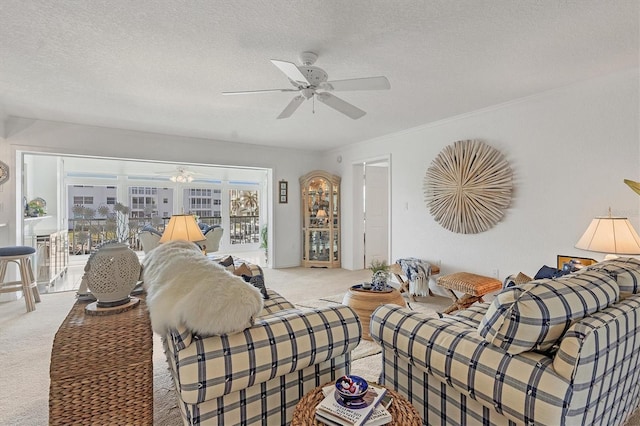 living room with a textured ceiling, light colored carpet, and ceiling fan