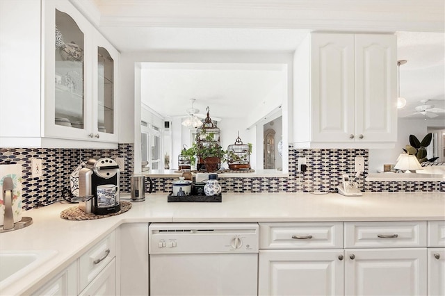 kitchen featuring decorative backsplash, white cabinetry, dishwasher, and sink