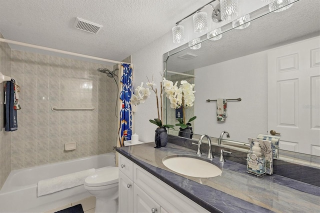 full bathroom featuring vanity, shower / bath combo, tile patterned floors, toilet, and a textured ceiling