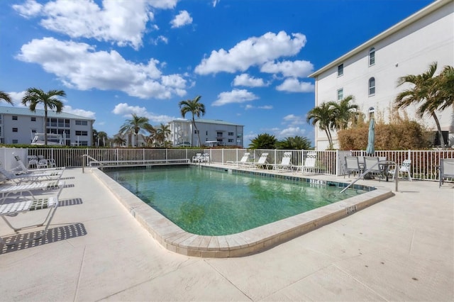 view of swimming pool with a patio area