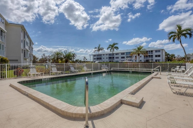 view of swimming pool featuring a patio area