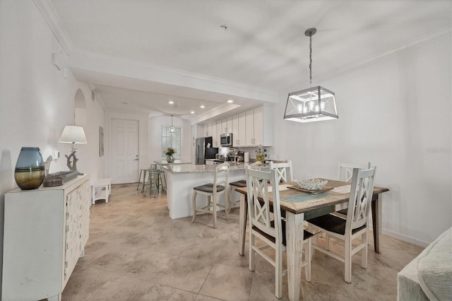 dining area with crown molding