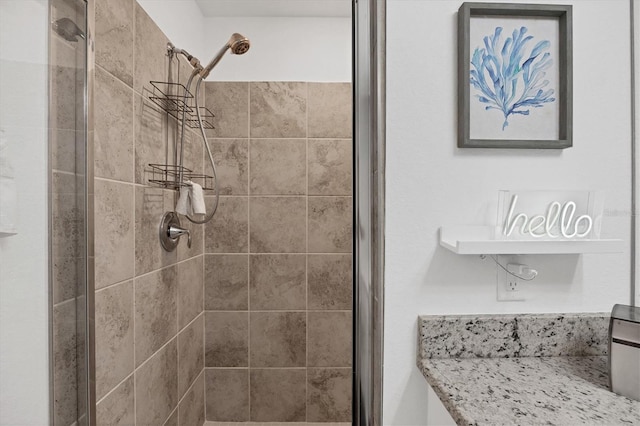 bathroom with a tile shower