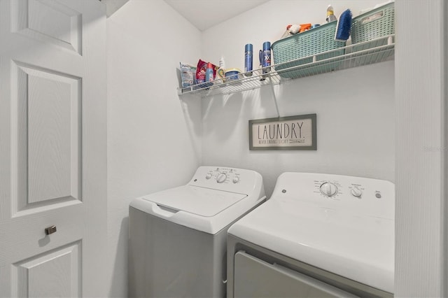 laundry area with separate washer and dryer