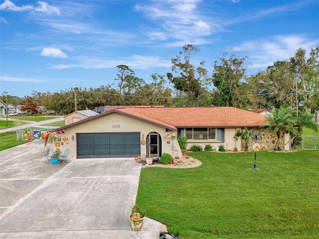 ranch-style home with a garage and a front lawn