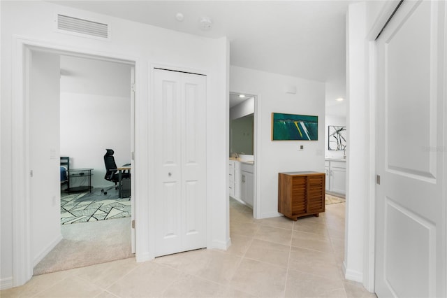 hallway with light tile patterned flooring