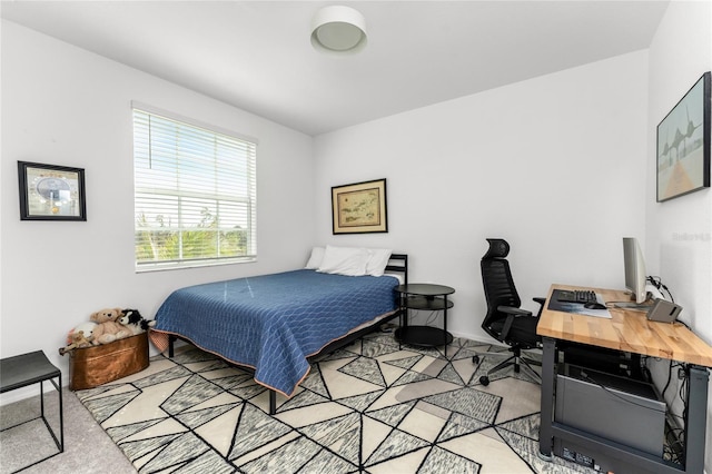 bedroom featuring light carpet