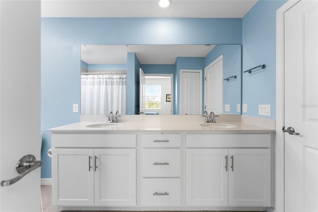 bathroom with tile patterned flooring and vanity