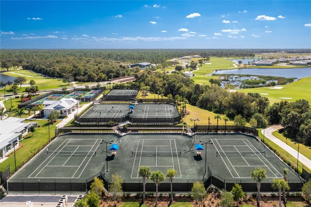 birds eye view of property with a water view