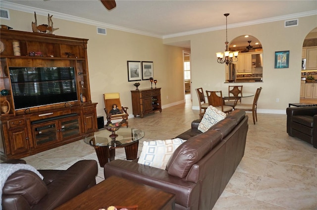 living room featuring a notable chandelier and crown molding