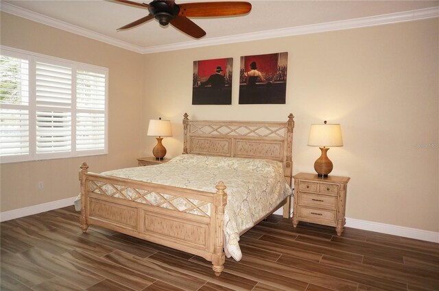 bedroom featuring baseboards, wood finished floors, ornamental molding, and a ceiling fan
