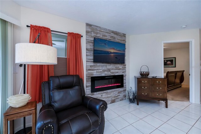 living area with a fireplace and light tile patterned floors