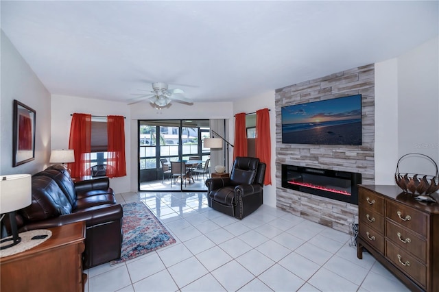 tiled living room featuring ceiling fan and a fireplace