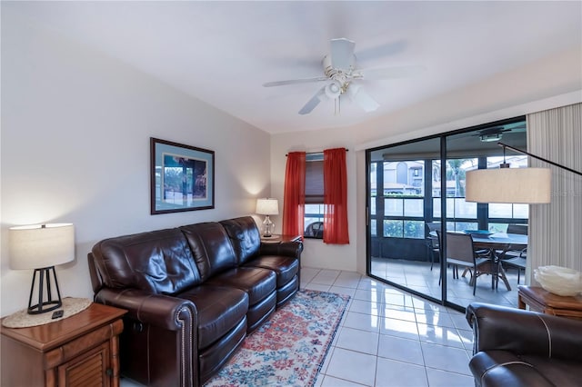 tiled living room featuring ceiling fan