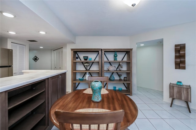 dining area with light tile patterned flooring