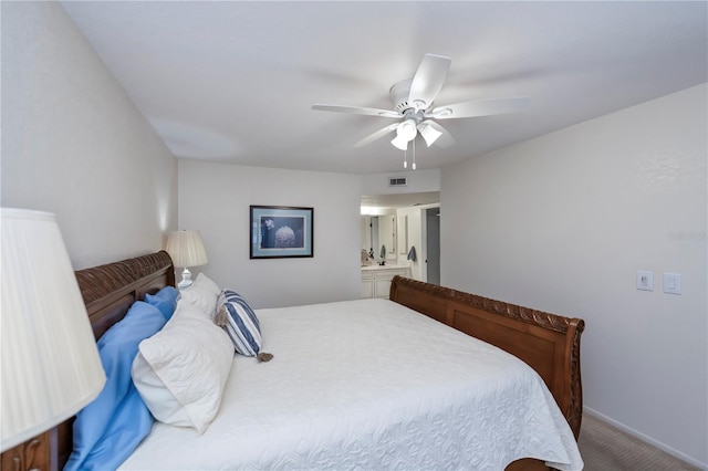 carpeted bedroom featuring ensuite bathroom and ceiling fan