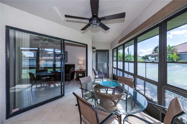 sunroom featuring ceiling fan