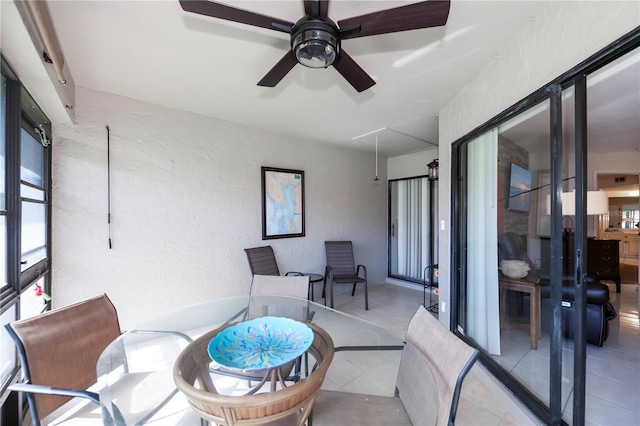 interior space with ceiling fan