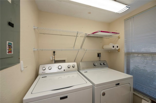 washroom featuring washing machine and dryer