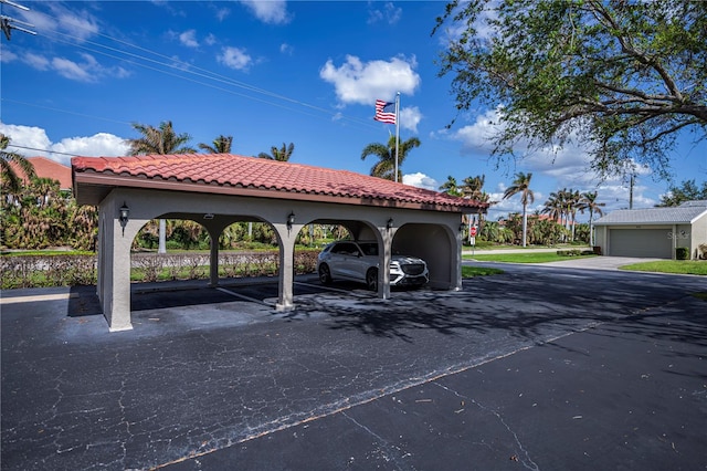 view of vehicle parking with a carport