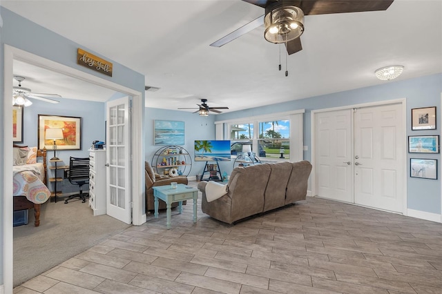 living room featuring light wood-type flooring and french doors