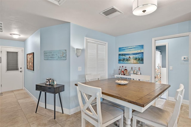 dining room featuring light tile patterned floors