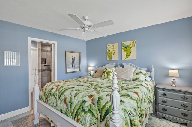 bedroom with ensuite bathroom and ceiling fan