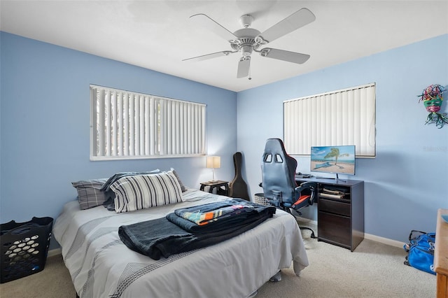 carpeted bedroom with ceiling fan