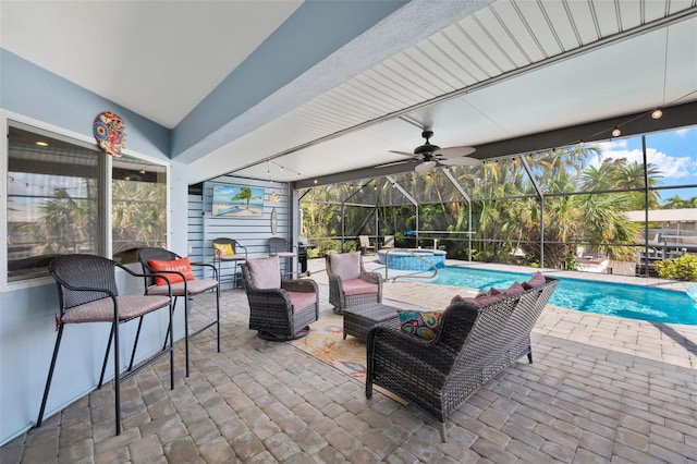 view of patio / terrace featuring outdoor lounge area, glass enclosure, and ceiling fan