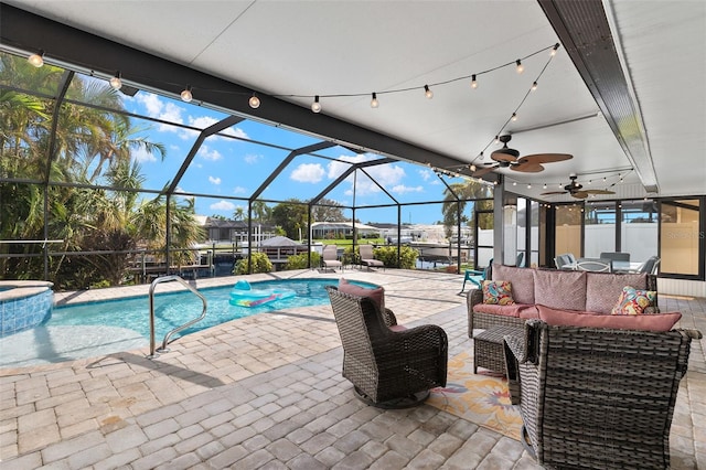 view of pool featuring ceiling fan, a patio area, a lanai, and an outdoor hangout area